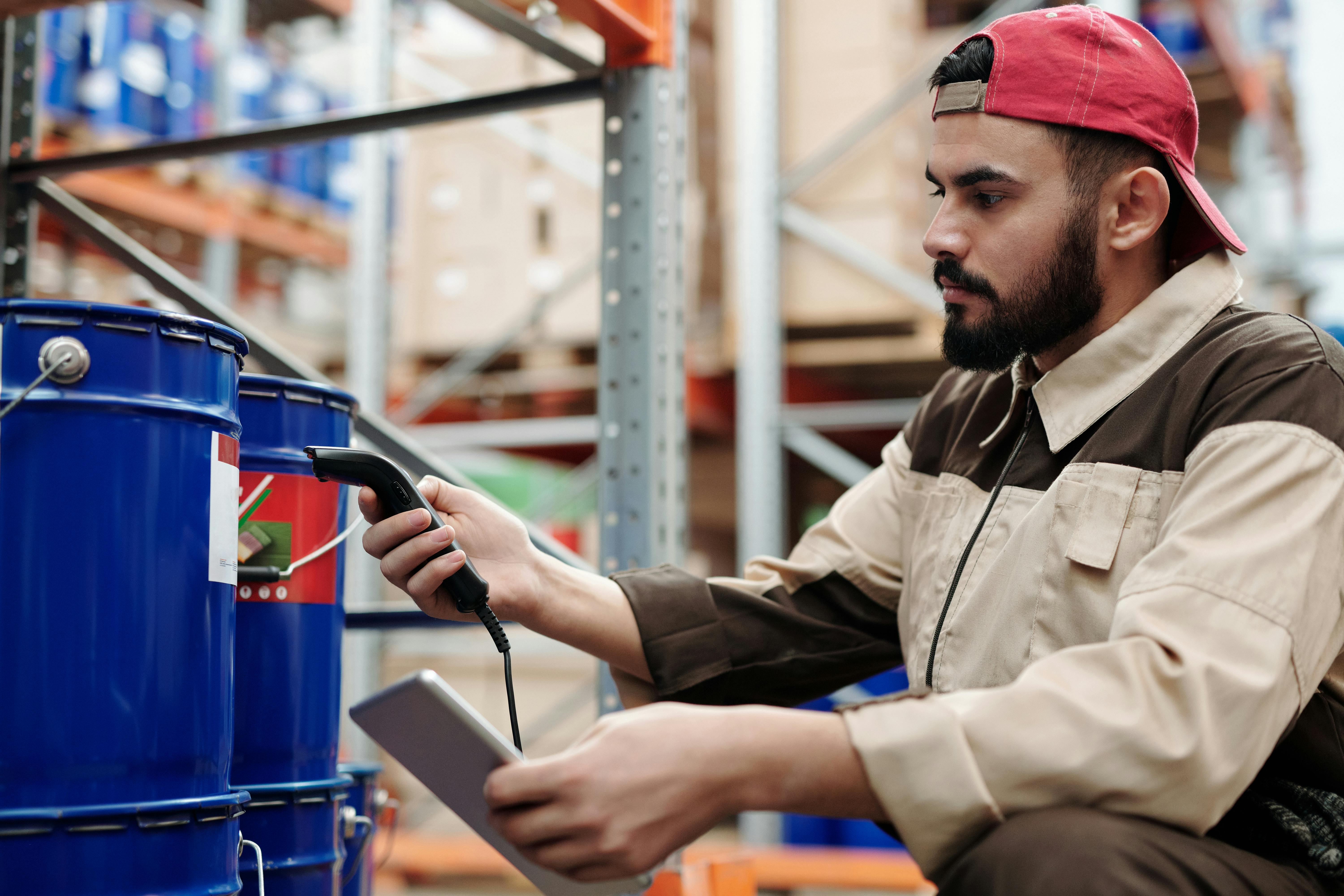 Man scanning inventory with a digital tablet